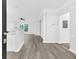 Bright living room features hardwood floors, neutral paint, and open-concept floor plan at 1623 Telfair Way, Charleston, SC 29412