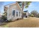 Rear exterior view of home showing the lawn and patio at 1739 Waterbrook Dr, Charleston, SC 29414