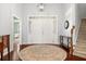 Bright foyer with hardwood floors, chandelier, and staircase leading to the upper level at 1739 Waterbrook Dr, Charleston, SC 29414