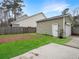 Spacious backyard featuring a detached garage and well-manicured lawn ready for outdoor activities at 1747 Towne St, Johns Island, SC 29455