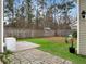 Landscaped backyard with a patio and fenced-in area, perfect for relaxing and enjoying the outdoors at 1747 Towne St, Johns Island, SC 29455