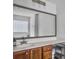 Bright bathroom with a large mirror, ample counter space, wooden cabinets, and modern fixtures at 1747 Towne St, Johns Island, SC 29455
