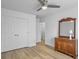 Bedroom features a ceiling fan, wood floors, ample closet space, and a traditional wood dresser at 1747 Towne St, Johns Island, SC 29455