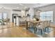 Dining room and kitchen with stainless steel appliances and dining table with seating at 1747 Towne St, Johns Island, SC 29455