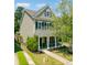 Charming two-story home with a welcoming front porch and well-manicured lawn in a desirable neighborhood at 1747 Towne St, Johns Island, SC 29455
