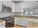 Kitchen featuring stainless steel appliances, granite countertops, and white cabinets at 1747 Towne St, Johns Island, SC 29455