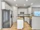 Bright kitchen features white cabinets, stainless steel appliances, and granite countertops at 1747 Towne St, Johns Island, SC 29455