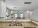 A well lit kitchen featuring granite countertops overlooking the adjacent living area at 1747 Towne St, Johns Island, SC 29455