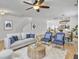 Bright living room featuring hardwood floors, a ceiling fan, and stylish furniture at 1747 Towne St, Johns Island, SC 29455