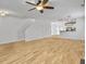 Spacious living room boasts hardwood floors, a staircase, and access to other rooms at 1747 Towne St, Johns Island, SC 29455
