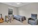 Bedroom with a twin bed, desk, gray chair, ceiling fan, carpet, and natural light from the window at 1750 Deer Path Dr, Mount Pleasant, SC 29464