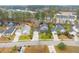 Aerial view of a residential neighborhood featuring well-maintained homes, lawns, and mature trees at 186 Jupiter Ln, Summerville, SC 29483