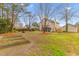 Expansive backyard featuring mature trees, established landscaping, and a charming outdoor setting at 186 Jupiter Ln, Summerville, SC 29483