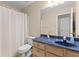 Bathroom featuring a large mirror and a blue countertop, with a shower in the background at 186 Jupiter Ln, Summerville, SC 29483