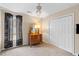 Bedroom with carpeted floors, a ceiling fan, closet, and a dresser with lamps at 186 Jupiter Ln, Summerville, SC 29483