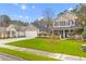 Exterior view of a home with manicured landscaping, a green lawn and a two-car garage at 186 Jupiter Ln, Summerville, SC 29483