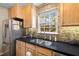 Modern kitchen sink area featuring stainless steel appliances and a bright window at 186 Jupiter Ln, Summerville, SC 29483