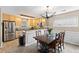 This kitchen features stainless steel appliances, light wood cabinets, and adjacent dining area at 186 Jupiter Ln, Summerville, SC 29483