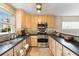 This traditional kitchen features stainless steel appliances, light wood cabinets, and tiled backsplash at 186 Jupiter Ln, Summerville, SC 29483