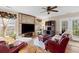 Comfortable living room featuring a stone accent wall and large windows for natural light at 186 Jupiter Ln, Summerville, SC 29483