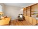 Office room with built-in wooden bookshelves and a wooden desk at 186 Jupiter Ln, Summerville, SC 29483