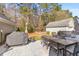 Backyard featuring an outdoor dining set, covered grill, and seating area, perfect for entertaining at 1901 Hubbell Dr, Mount Pleasant, SC 29466