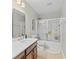 Well-lit bathroom with a shower-tub combo, modern vanity, large mirror, and tile flooring at 1901 Hubbell Dr, Mount Pleasant, SC 29466