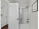 Clean bathroom featuring a shower with glass doors, crisp white tiles, and neutral decor at 1901 Hubbell Dr, Mount Pleasant, SC 29466