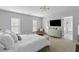 This primary bedroom is spacious and features natural light, seating, and access to a patio at 1901 Hubbell Dr, Mount Pleasant, SC 29466