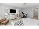 Bright and airy bedroom with exercise bike, television, and access to a private balcony at 1901 Hubbell Dr, Mount Pleasant, SC 29466
