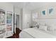 Bedroom featuring a large bed with a padded headboard, neutral walls, natural light and a bookcase at 1901 Hubbell Dr, Mount Pleasant, SC 29466