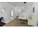 Bright breakfast nook featuring a marble table, built-in seating, and easy access to stairs and outdoor patio at 1901 Hubbell Dr, Mount Pleasant, SC 29466