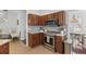Charming kitchen featuring stainless steel appliances, wood cabinetry, and light gray backsplash at 1901 Hubbell Dr, Mount Pleasant, SC 29466