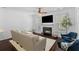 Cozy living room with a fireplace, large windows, and neutral furnishings at 1901 Hubbell Dr, Mount Pleasant, SC 29466