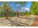 Scenic walking path winds beside a serene lake with a fountain, surrounded by trees and greenery, creating a tranquil setting at 1901 Hubbell Dr, Mount Pleasant, SC 29466