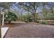 Spacious backyard with mature trees and a privacy fence, great for outdoor activities at 1942 Oak Tree Ln, Mount Pleasant, SC 29464