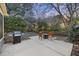 Relaxing backyard patio with a fire pit, grill and manicured lawn at 1942 Oak Tree Ln, Mount Pleasant, SC 29464