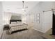 Bright bedroom features ensuite bathroom with sliding barn door and a large window at 1942 Oak Tree Ln, Mount Pleasant, SC 29464