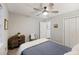 Bedroom featuring ceiling fan, gray walls, wood dresser, and doorway to another room at 1942 Oak Tree Ln, Mount Pleasant, SC 29464