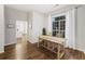 Bright dining area featuring natural wood table, large window and wood floors at 1942 Oak Tree Ln, Mount Pleasant, SC 29464