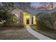 Inviting front entrance featuring a walkway, blooming bushes, and well-maintained landscaping at 1942 Oak Tree Ln, Mount Pleasant, SC 29464