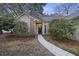 Charming home exterior with a welcoming front porch and manicured landscaping at 1942 Oak Tree Ln, Mount Pleasant, SC 29464