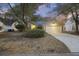 Charming one-story home with a two-car garage, landscaped yard, and inviting curb appeal at 1942 Oak Tree Ln, Mount Pleasant, SC 29464