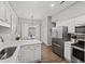 Bright eat-in kitchen featuring stainless steel appliances and white cabinets at 1942 Oak Tree Ln, Mount Pleasant, SC 29464