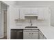 Bright kitchen features white cabinetry, modern stainless steel appliances, and marble countertops at 1942 Oak Tree Ln, Mount Pleasant, SC 29464