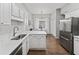 Bright kitchen featuring white cabinets, marble countertops, stainless steel appliances and a dining area at 1942 Oak Tree Ln, Mount Pleasant, SC 29464