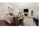 Cozy living room featuring a fireplace, modern furnishings, and a decorative rug on wood floors at 1942 Oak Tree Ln, Mount Pleasant, SC 29464