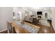 Open-concept space with living room and dining area, featuring wood floors and natural light at 1942 Oak Tree Ln, Mount Pleasant, SC 29464