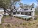 Gorgeous backyard featuring a private pool, patio, and well-maintained landscaping at 215 Fell Pt, Daniel Island, SC 29492