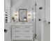 Bright bathroom featuring white tiling, glass shower, and modern fixtures at 215 Fell Pt, Daniel Island, SC 29492